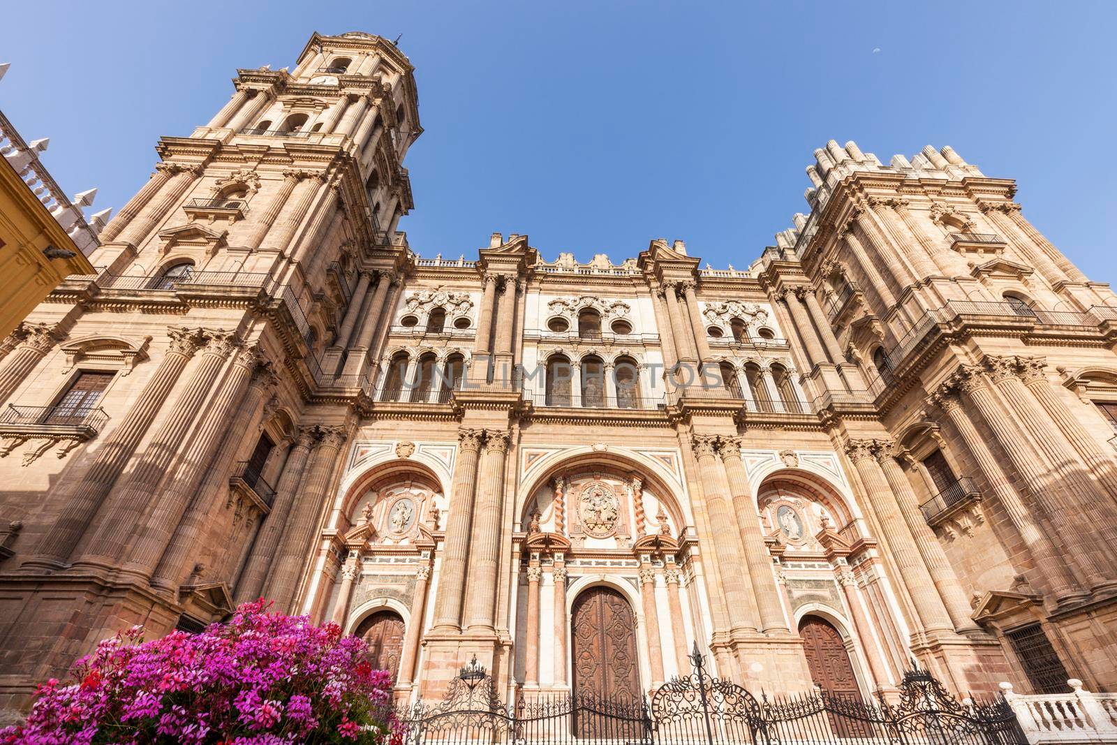 Malaga Cathedral and blue sky. Malaga, Andalusia, Spain.