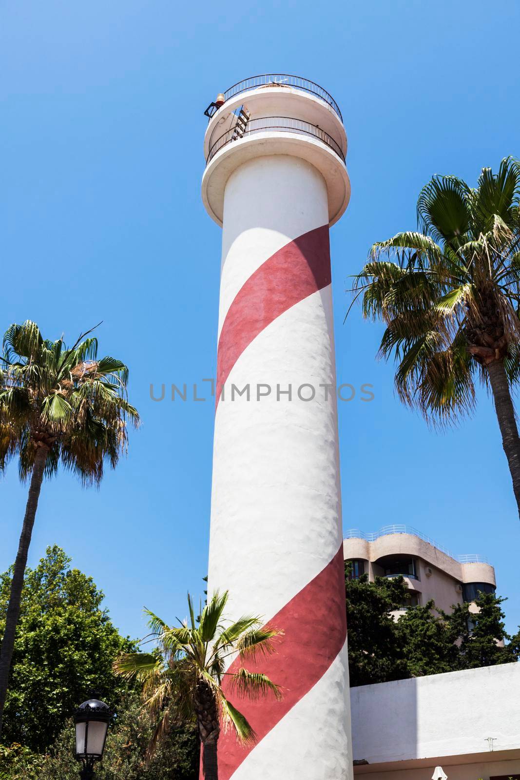 Marbella Lighthouse and blue sky. Marbella, Andalusia, Spain.