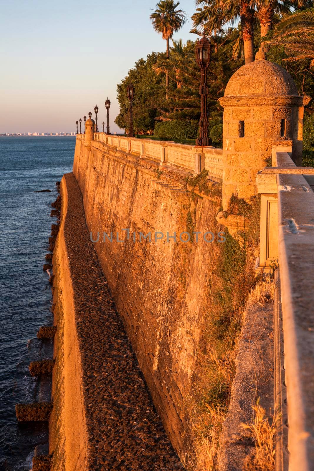 Old walls of Cadiz at sunset. Cadiz, Andalusia, Spain.