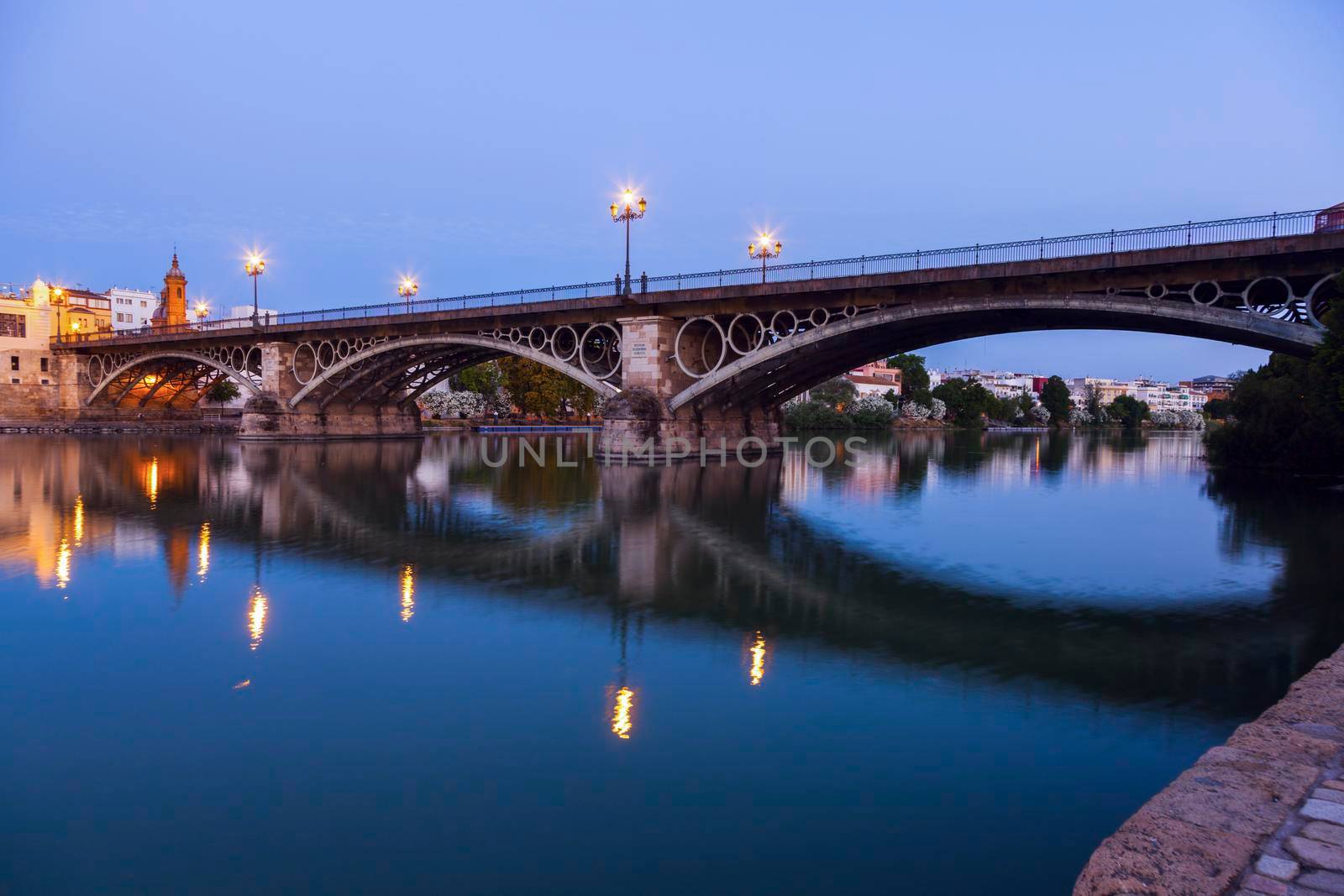 Chapel of Carmen and Isabel II Bridge in Seville. Seville, Andalusia, Spain.