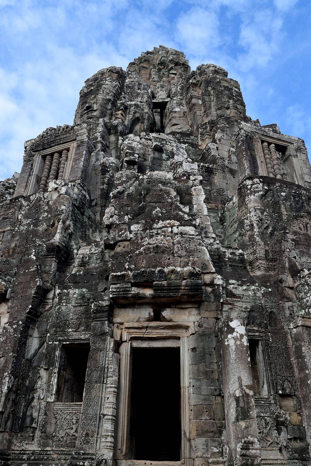 The faces of the Bayon in a cloudy day, Angkor Thom, Cambodia.