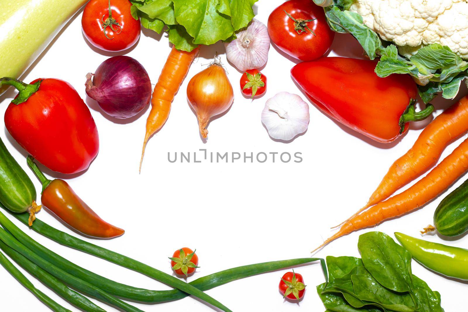 Vegetables layout on a white background . Home-grown vegetables. Harvest. Window dressing. Isolated vegetables. Article about vegetables. Agricultural industry. Copy space