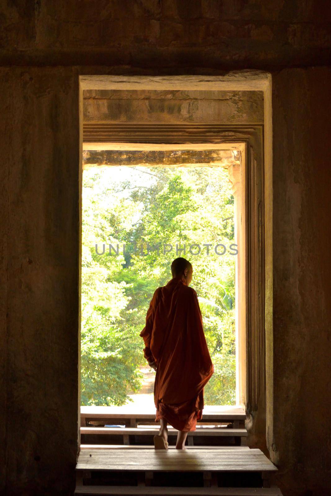 January 3rd 2017, Cambodia, Buddhist monk coming out of one of the doors of the Angkor Wat temple