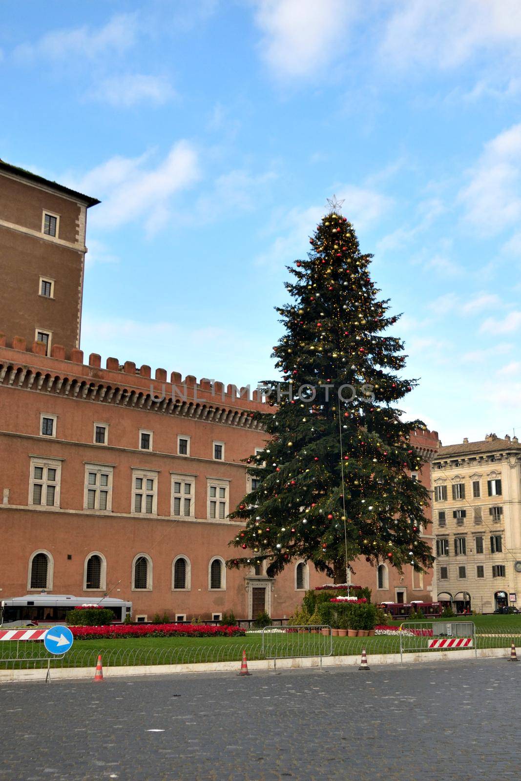 View of the famous Christmas tree in Piazza Venezia with few tourists due to the Covid19 epidemic.