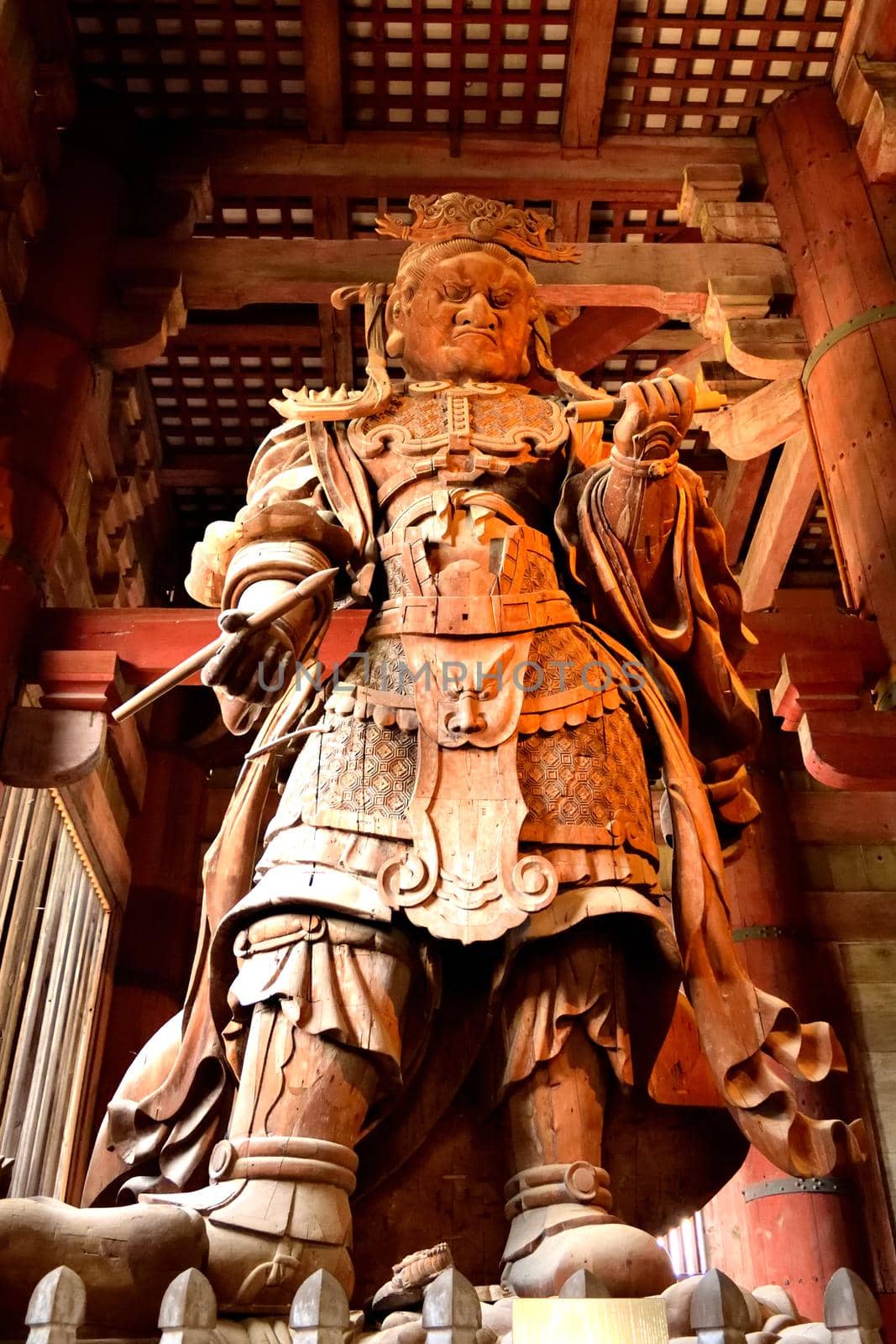 Closeup of a big Bodhisattva statue in the Todai Ji temple by silentstock639