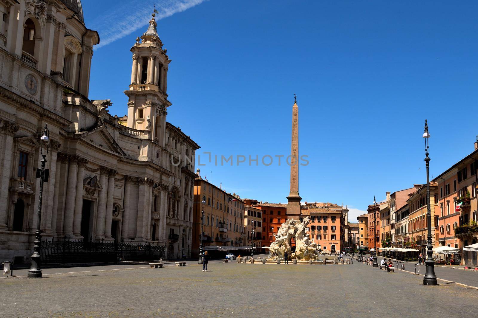 View of the Navona Square without tourists due to phase 2 of the lockdown by silentstock639