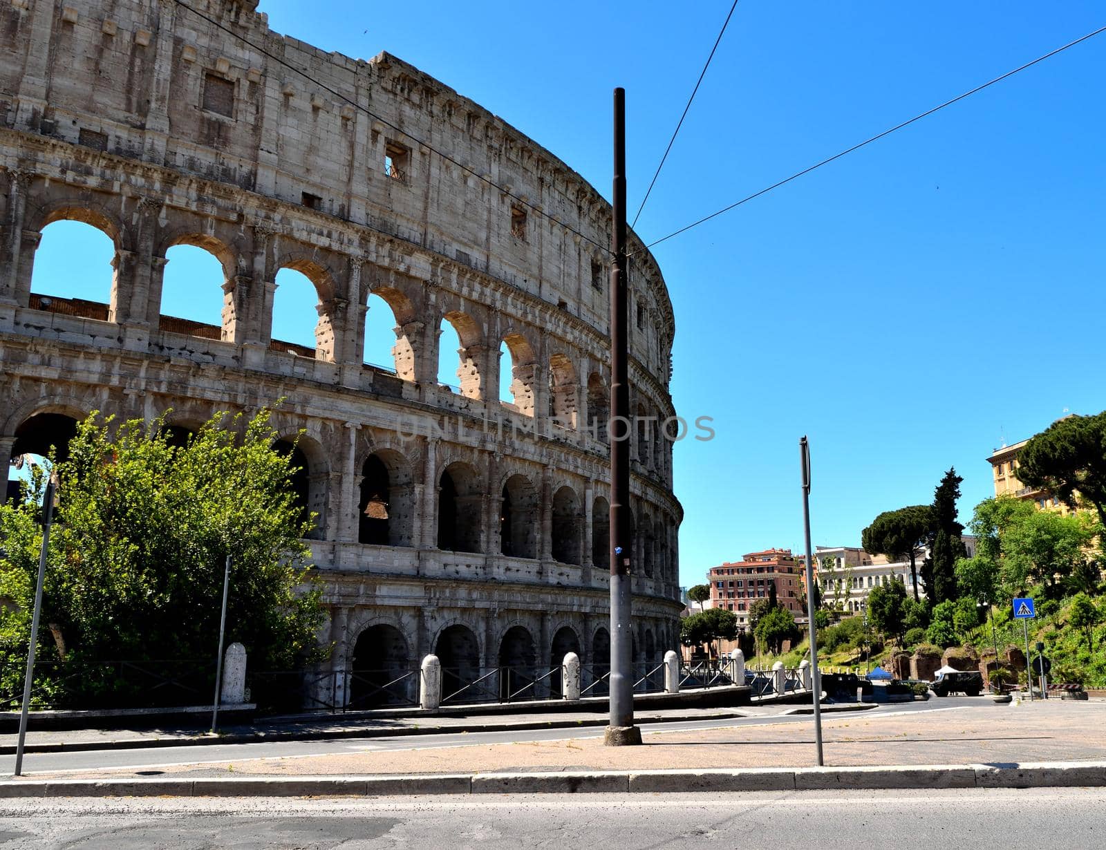 View of the Colosseum without tourists due to the phase 2 of lockdown by silentstock639
