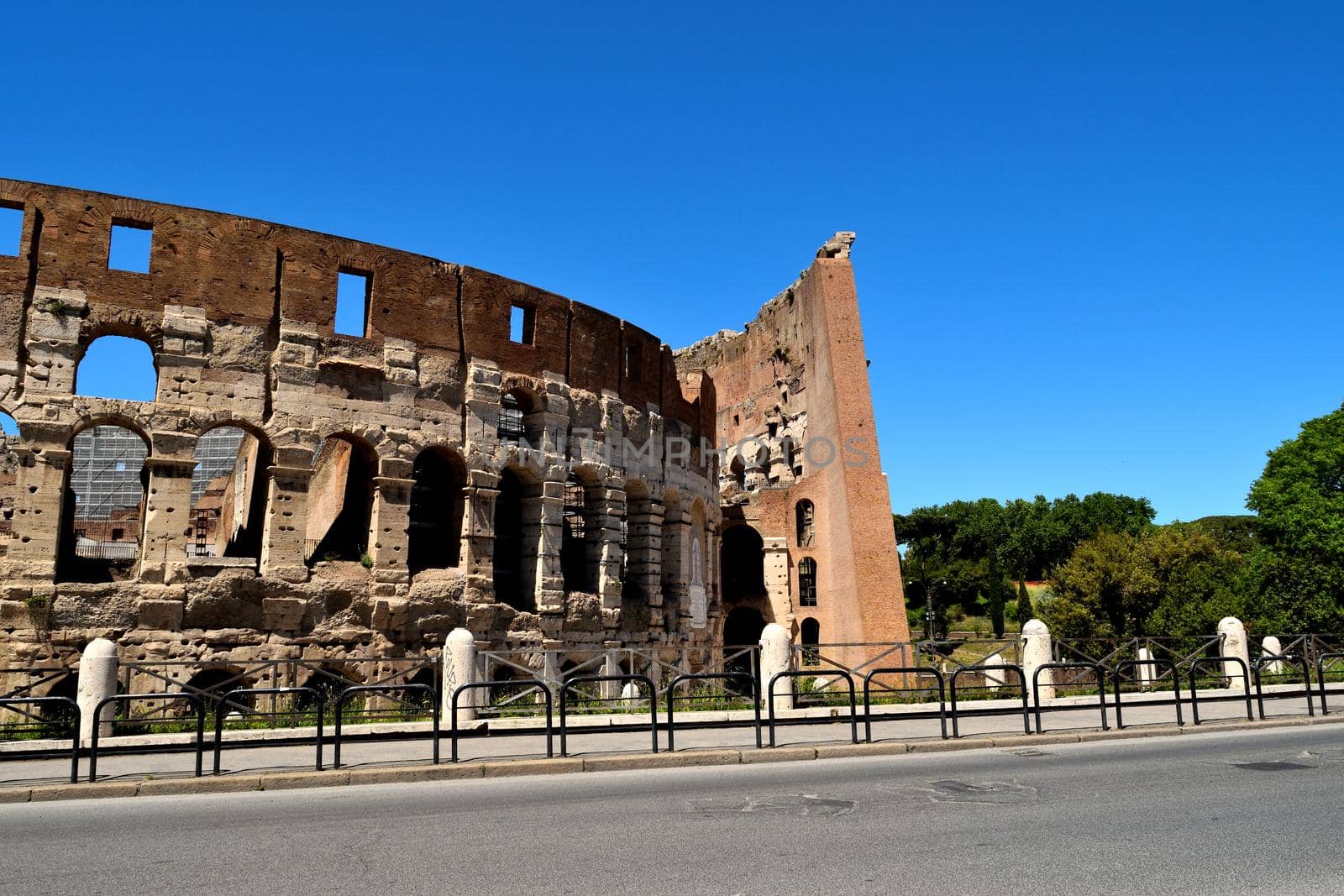 View of the Colosseum without tourists due to the phase 2 of lockdown by silentstock639