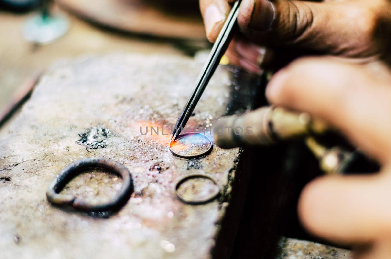 Industrial manufacture of the gold ring. Manufacture of a gold product in the jewelery workshop.