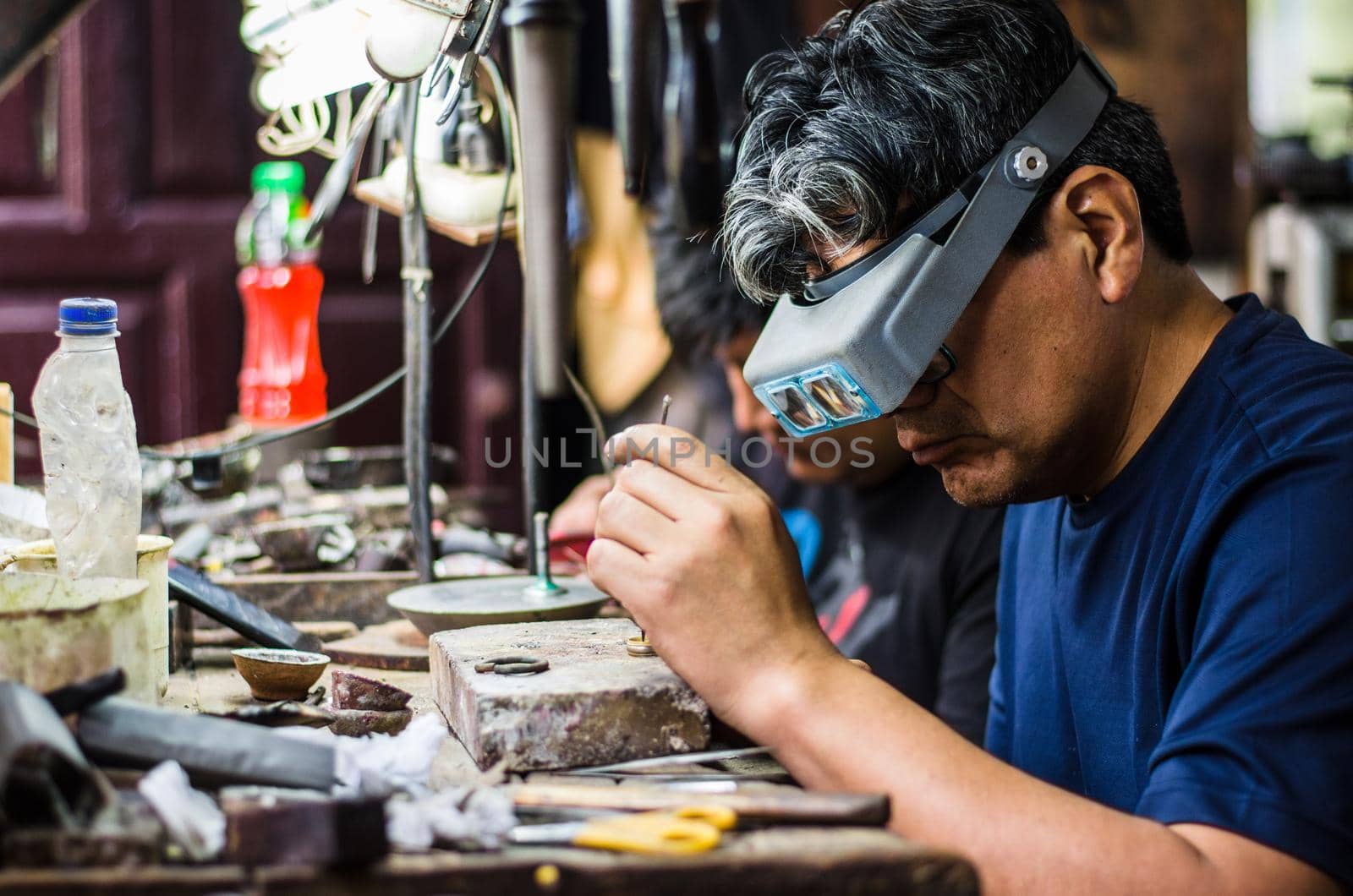 Craft jewelery making. Ring repairing. Putting the diamond on the ring.