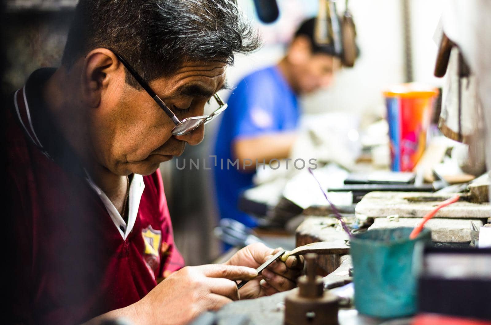 Craft jewelery making. Ring repairing. Putting the diamond on the ring.