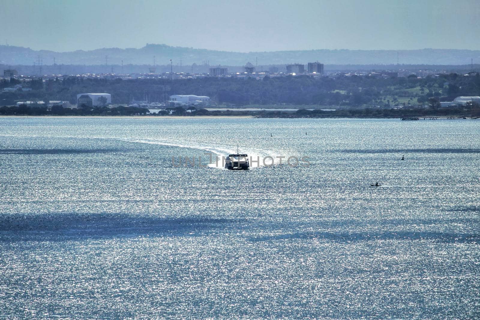 Passenger Ferry crossing the Tagus river in Lisbon on a sunny day