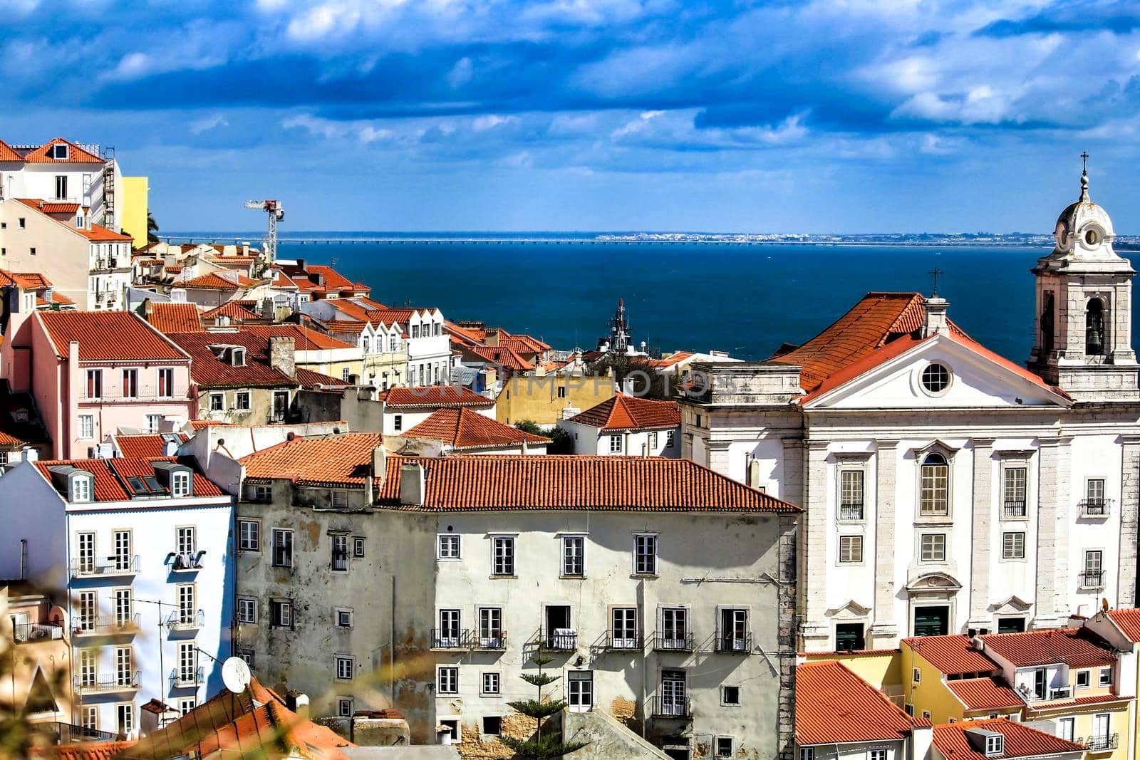 Beautiful panoramic view of Alfama neighborhood from the viewpoint of Santa Lucia in Lisbon on a sunny day