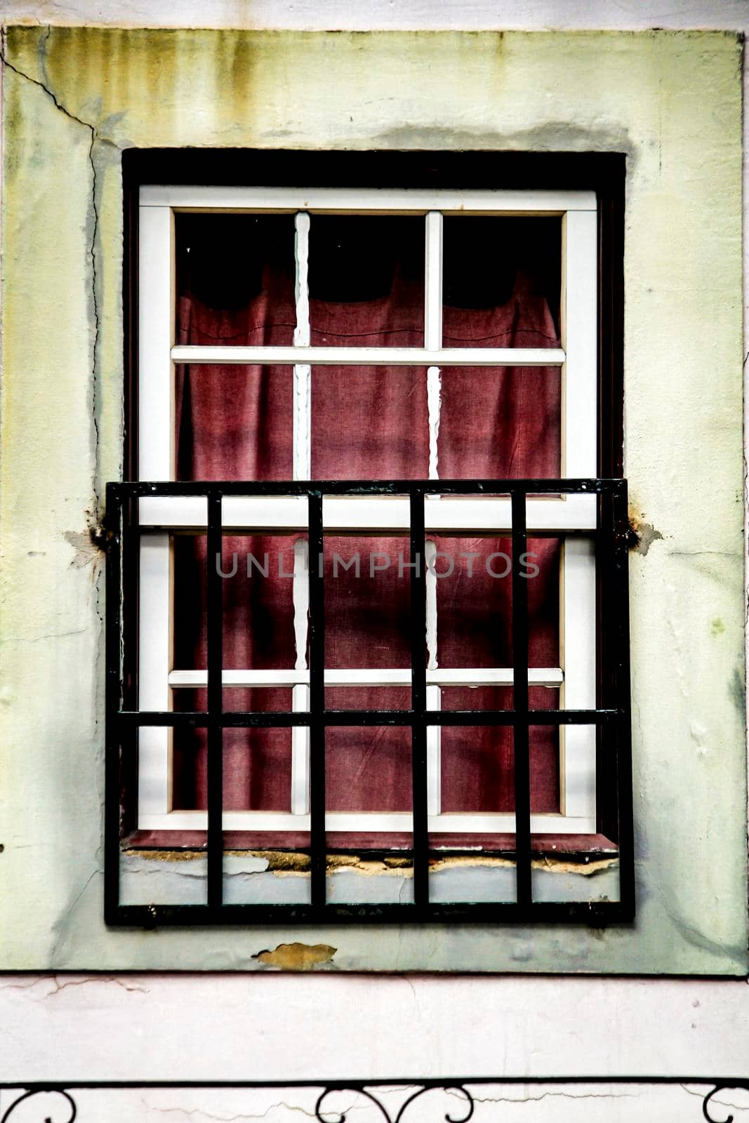 Old colorful typical facade in Lisbon with vintage wooden window