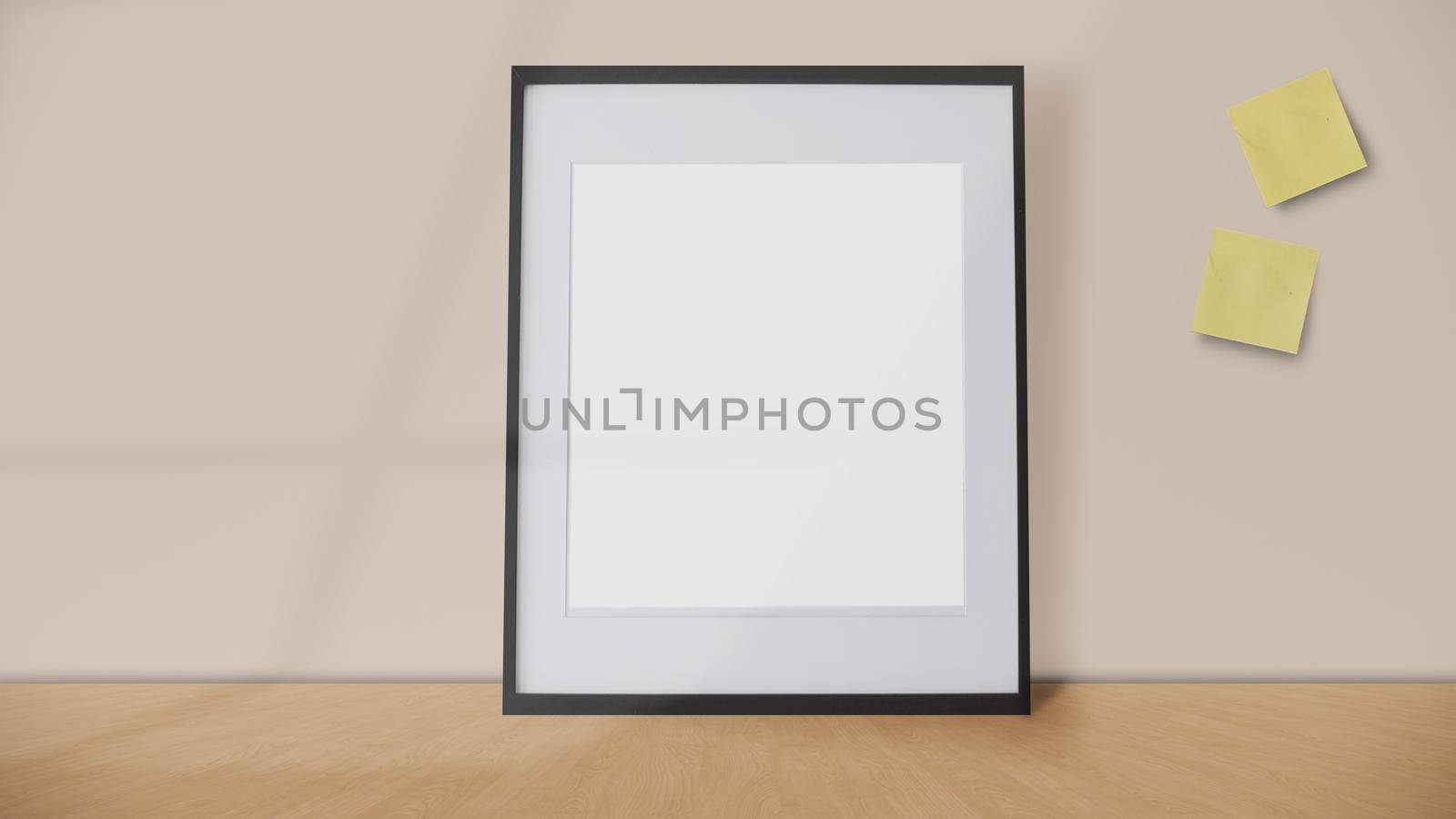 blank frame and yellow postit on a vintage wall background with window shadow