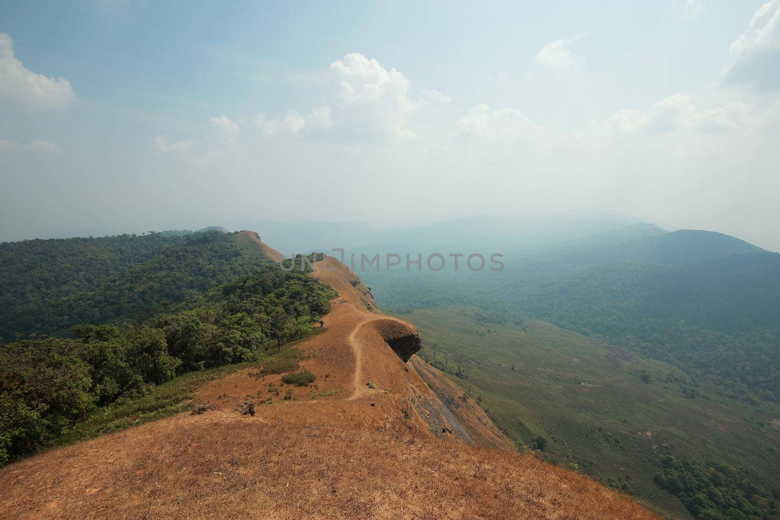 The highest point has mountains and the sky as the background.
