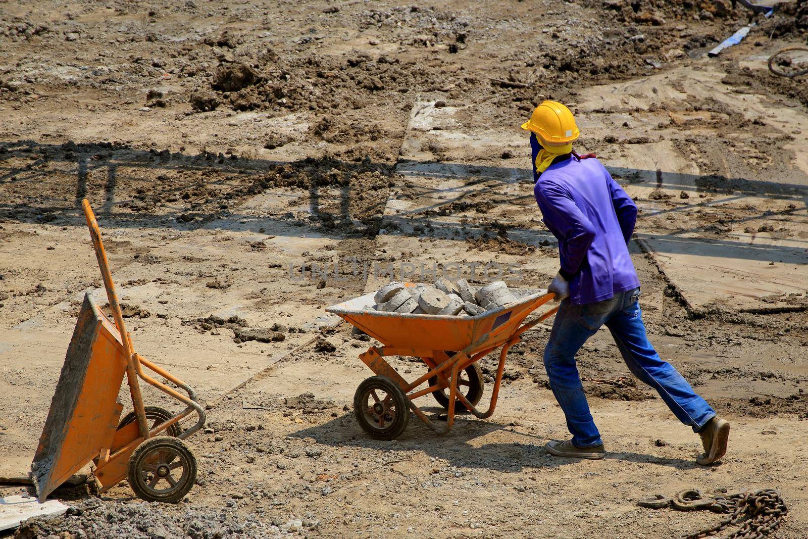 Construction worker And working in the construction area of ​​tall buildings