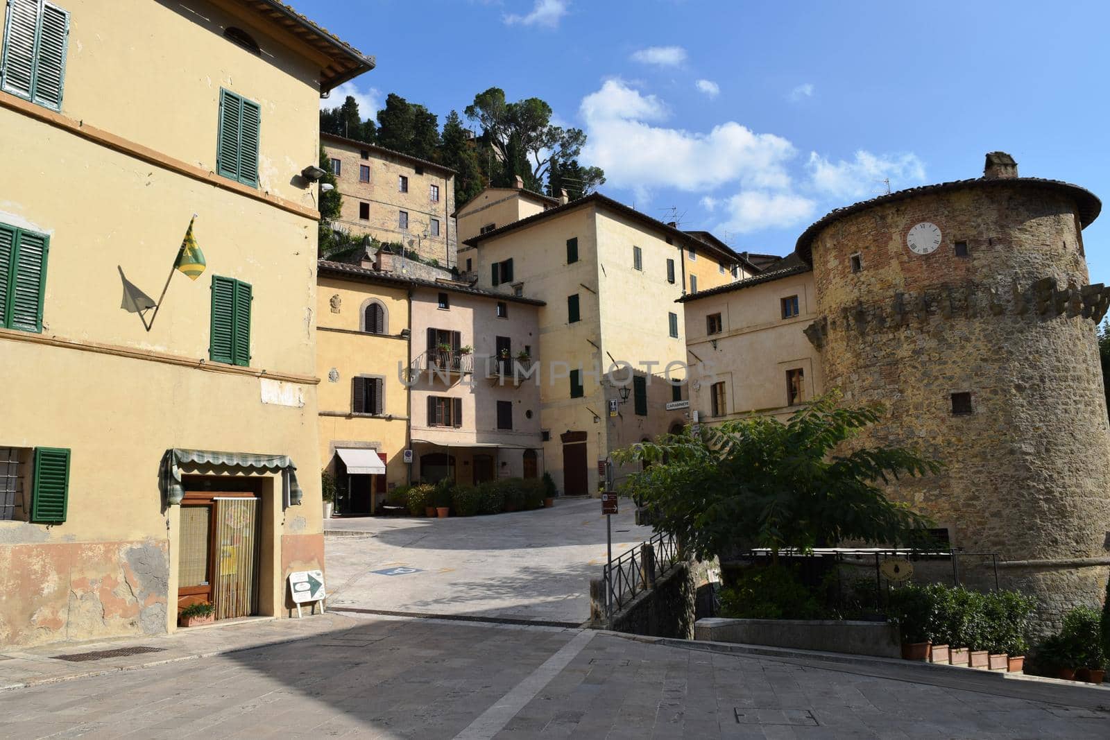 View of an ancient medieval village in the Tuscan countryside. by silentstock639