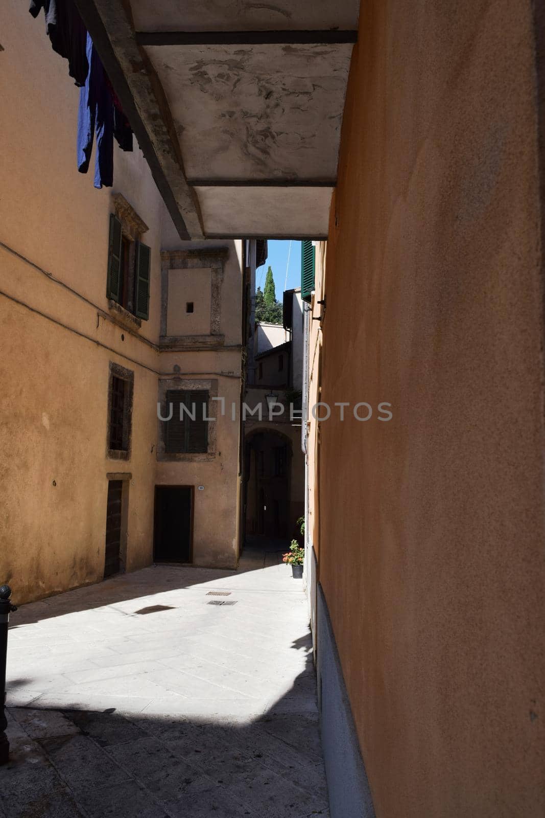 View of an ancient medieval village in the Tuscan countryside, Italy.