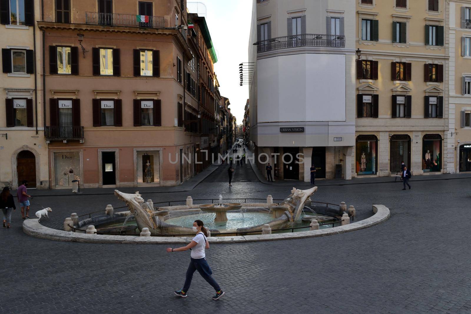 View of the Via dei Condotti and Piazza di Spagna without tourists due to the phase 2 of lockdown by silentstock639