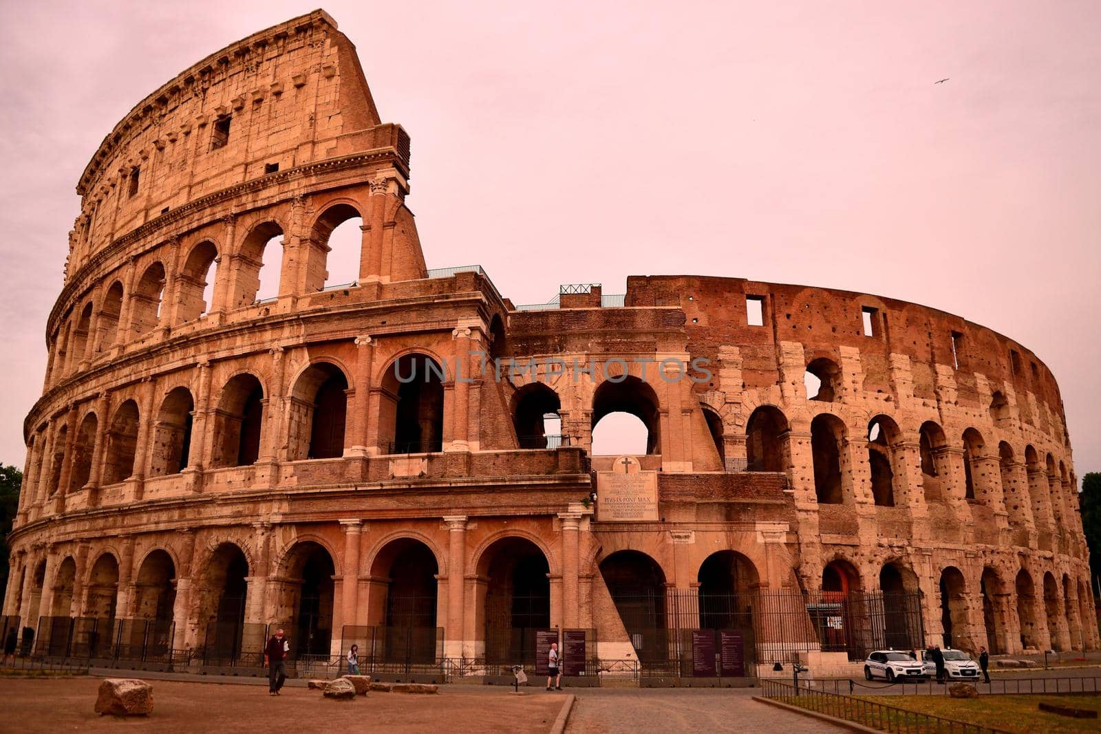 View of the Colosseum without tourists due to the phase 2 of lockdown by silentstock639