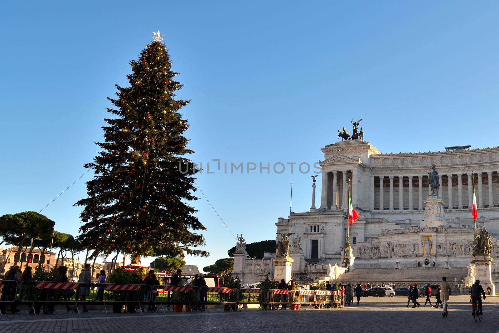 Rome, Italy - December 13th 2020: View of the famous Christmas tree in Piazza Venezia with few tourists due to the Covid19 epidemic.