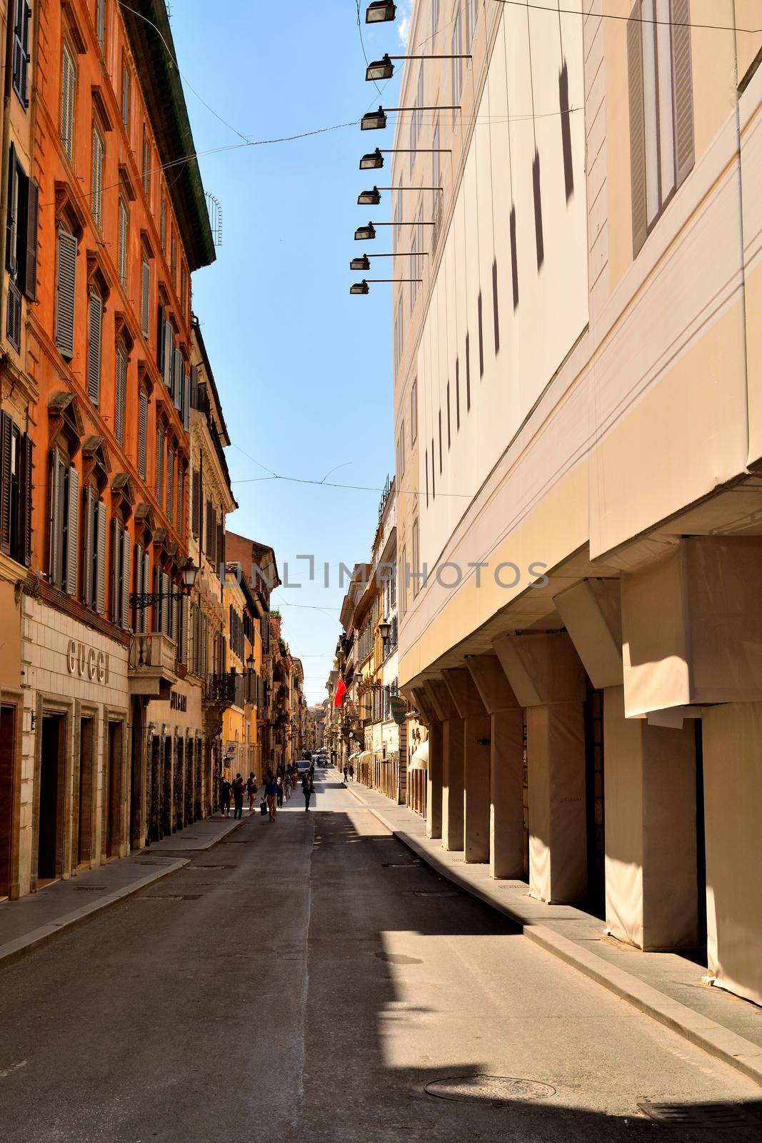 View of the Via dei Condotti without tourists due to the phase 2 of lockdown by silentstock639