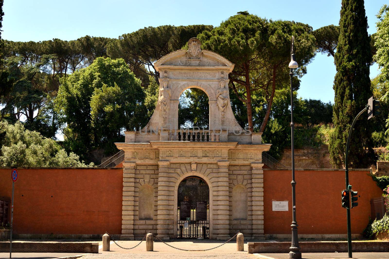 View of the entrance of Forum Romanum closed without tourists due to the phase 2 of lockdown by silentstock639