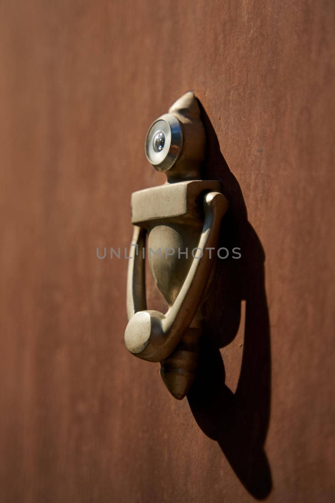 Unusual stylish door knocker in the shape of a robot.