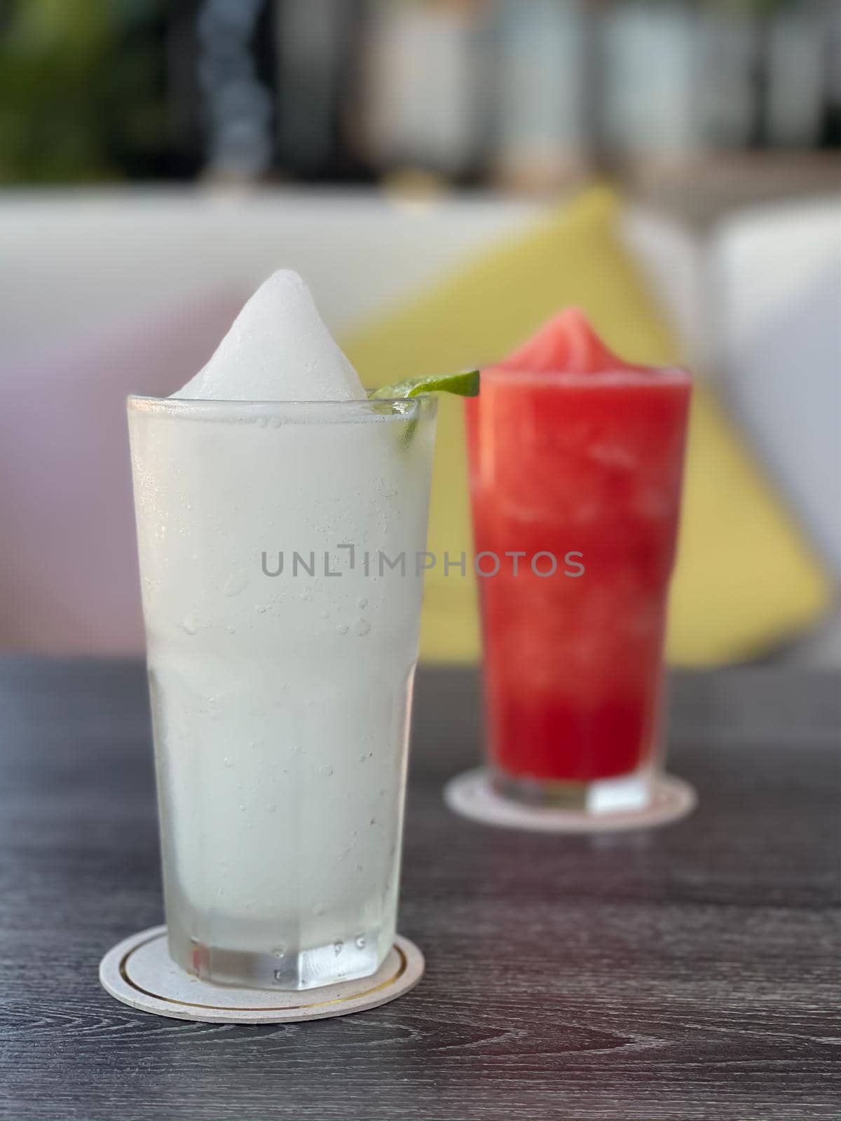 Lime smoothie in glass on grey table by punsayaporn