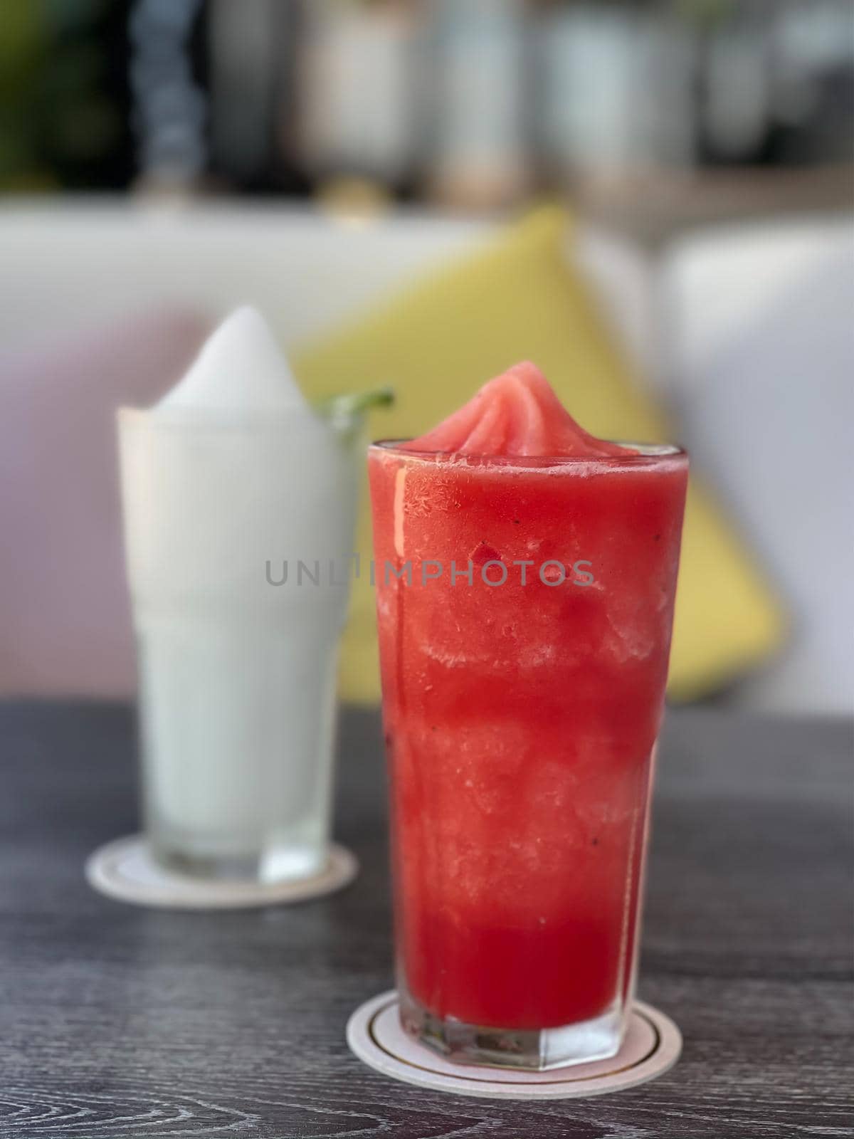 Watermelon smoothie in glass on grey table by punsayaporn