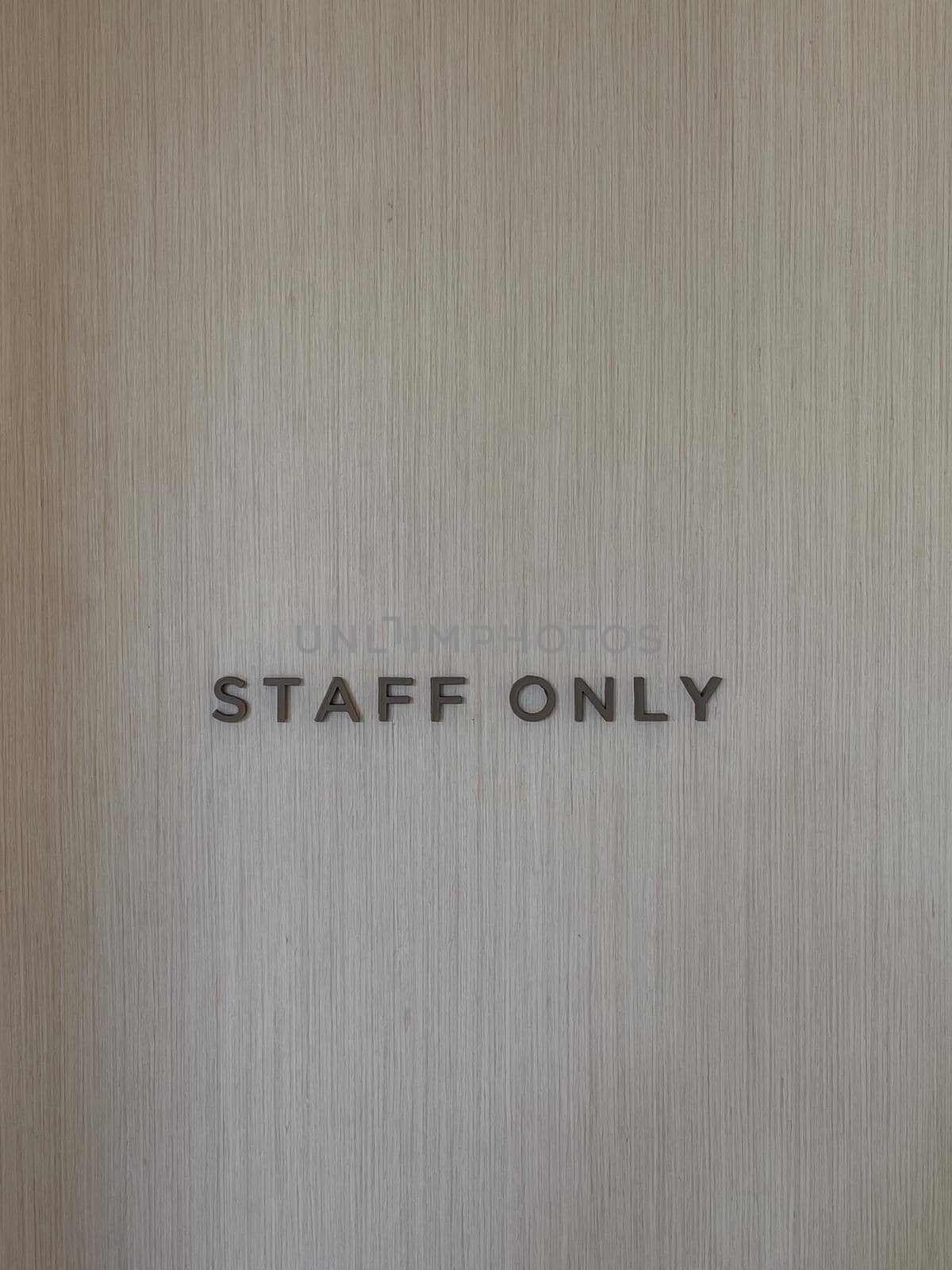 Staff only word on empty wall background by punsayaporn