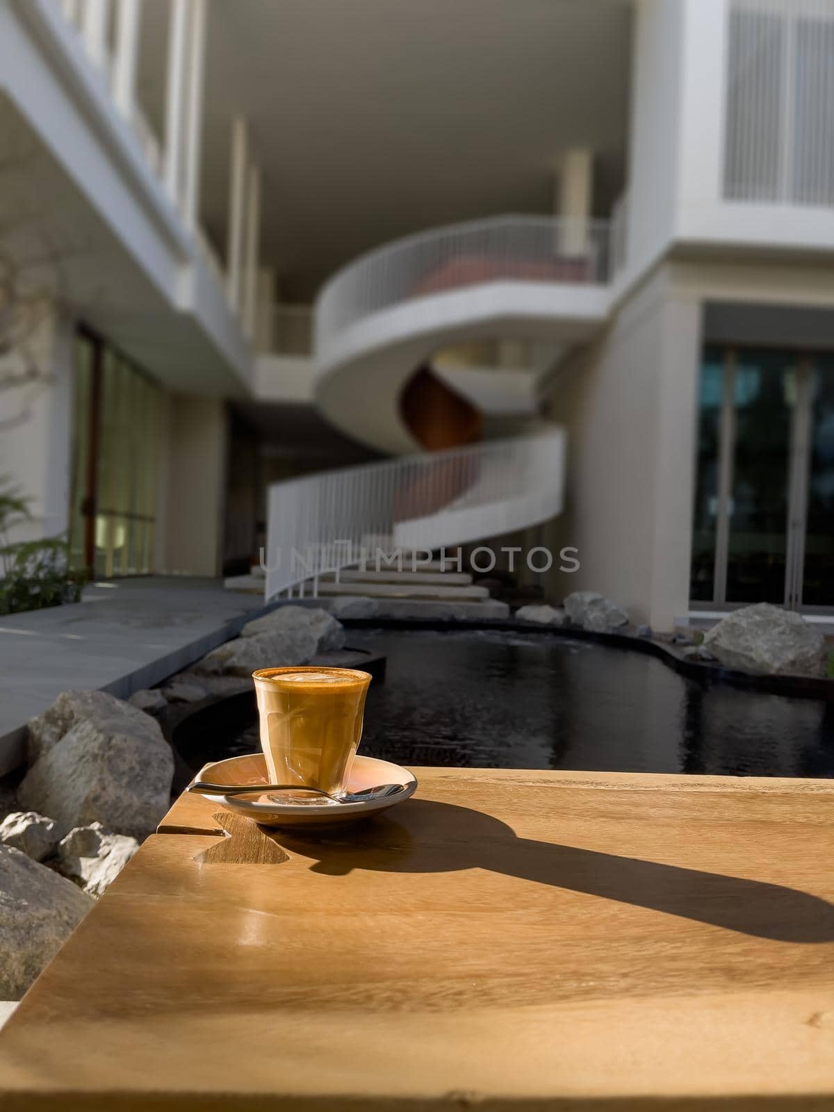 Hot coffee on wooden table by punsayaporn