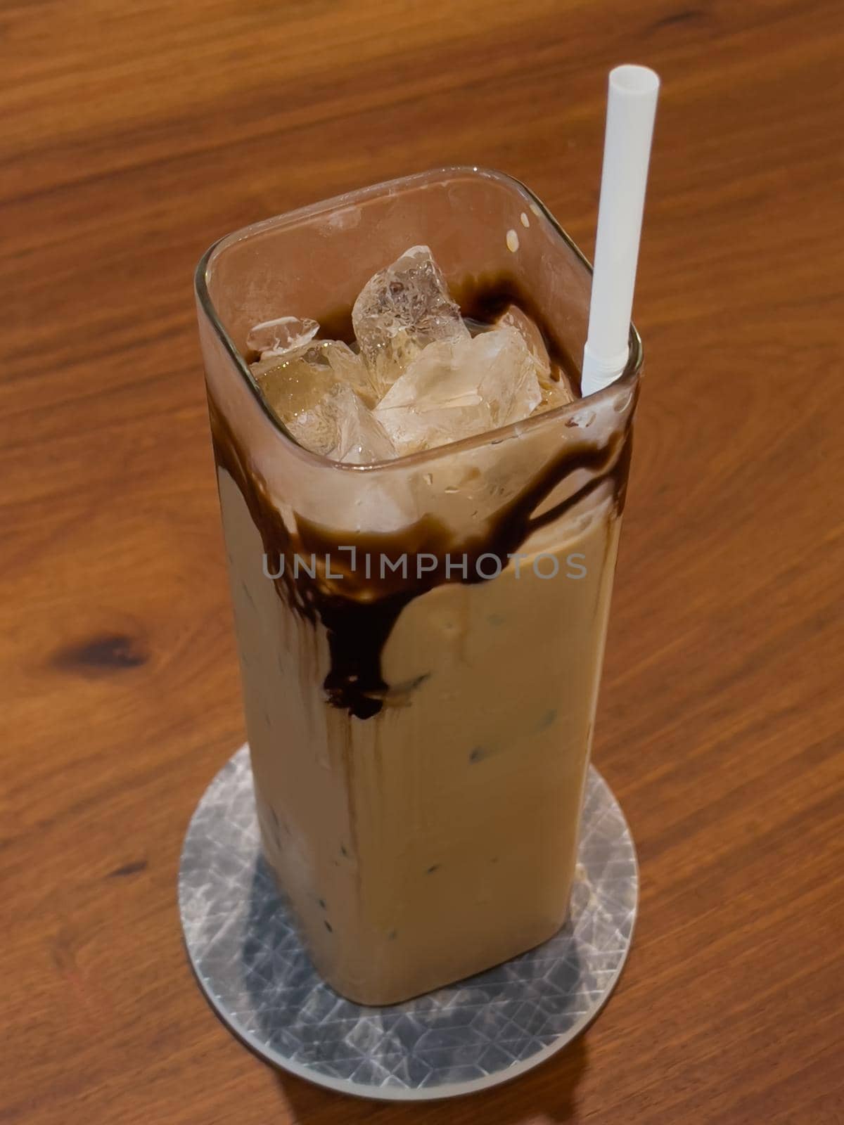 Iced coffee on wooden table, stock photo
