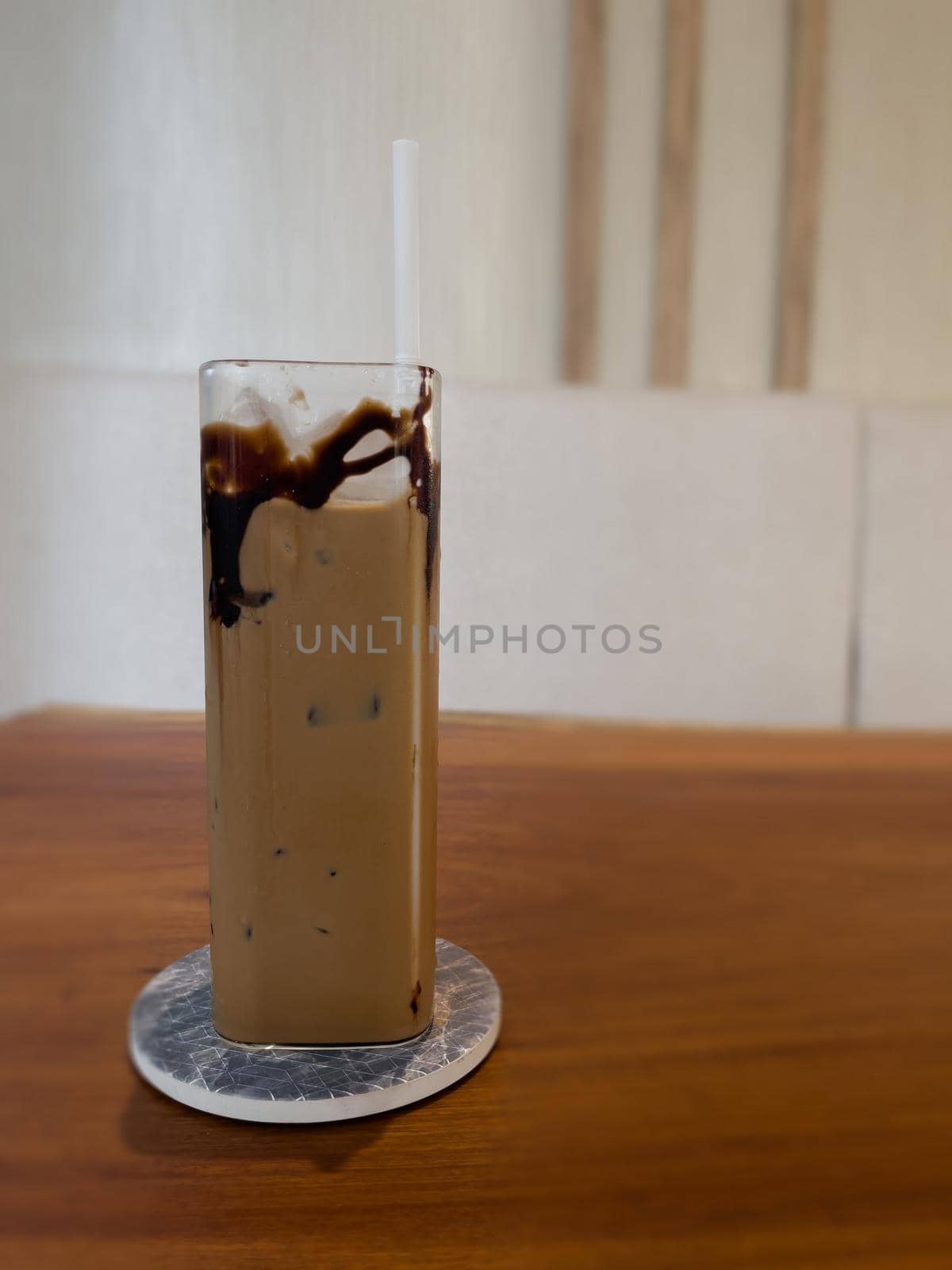 Iced coffee on wooden table, stock photo