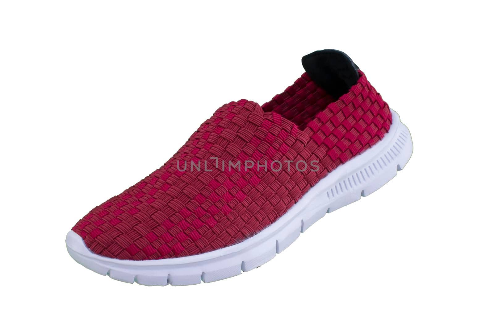 Red sneaker on a white sole. Sport shoes on a white background.