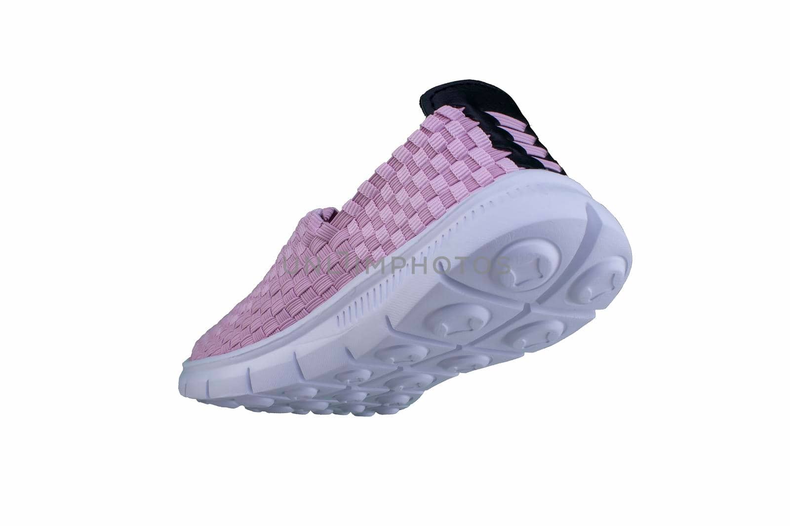 Sneaker pink on a white sole. Sport shoes on a white background.
