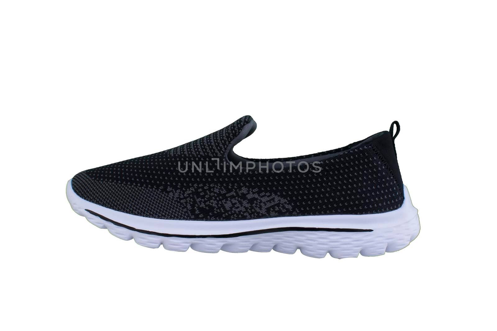 Black sneakers on white soles. Sport shoes on a white background.