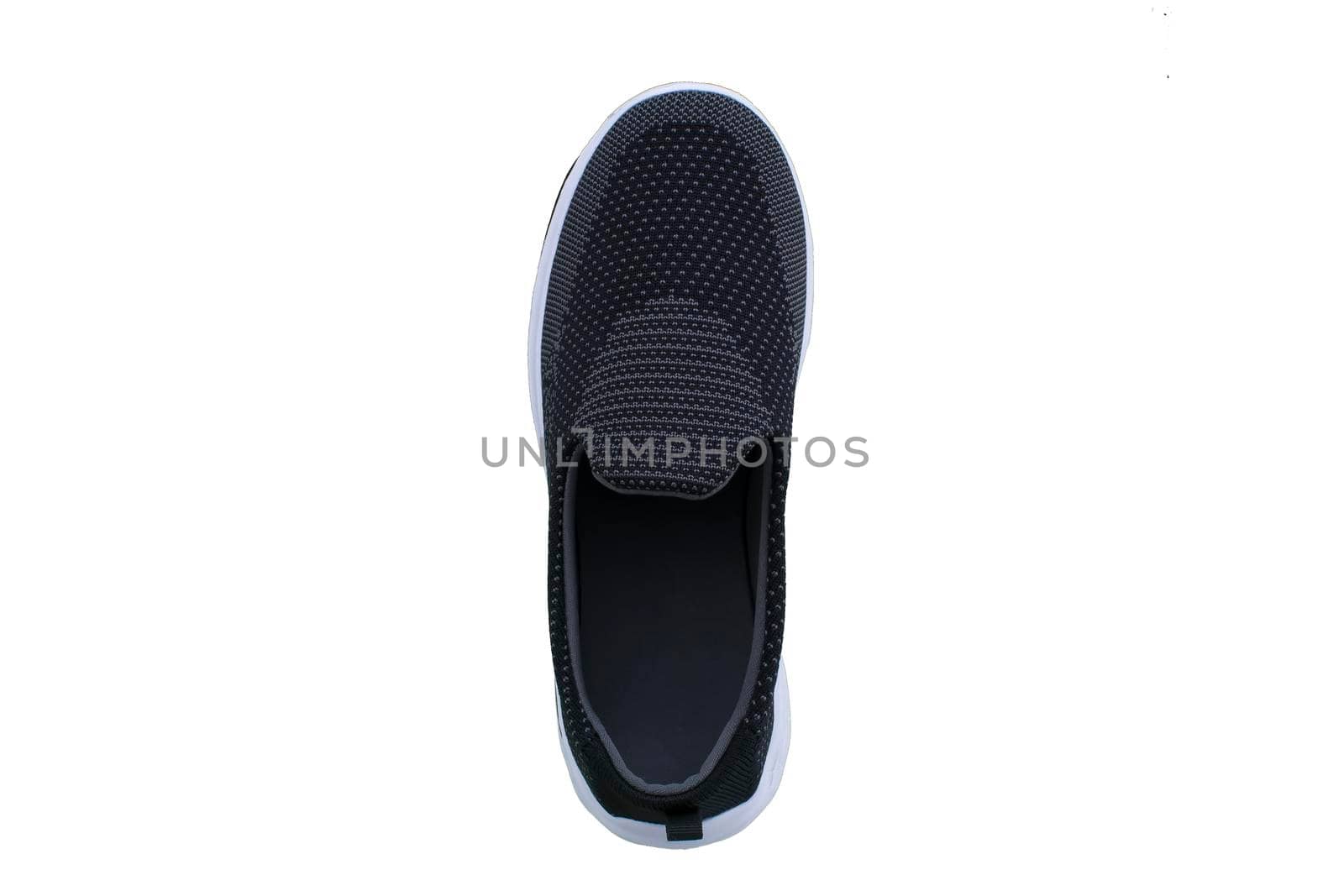 Black sneakers on white soles. Sport shoes on a white background.