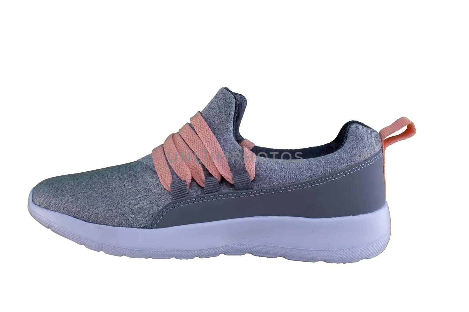 Gray sneaker with orange laces. Sport shoes on white background