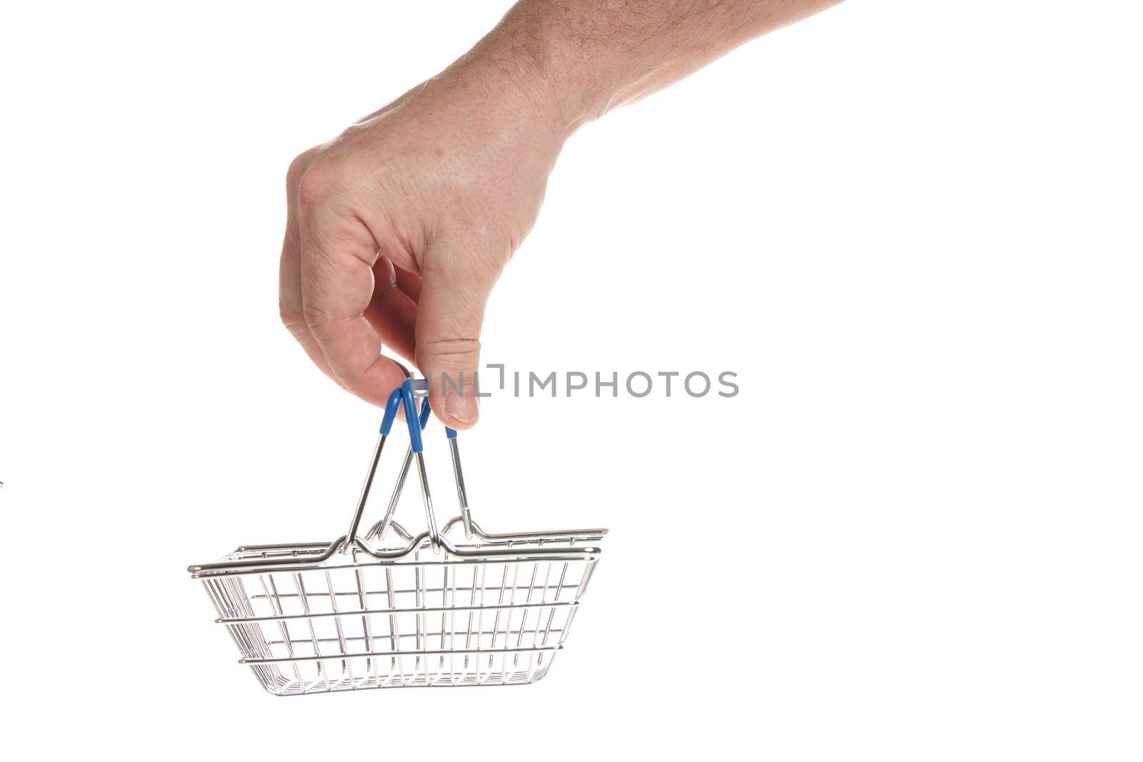 Hand holds an empty shopping cart from the supermarket on a white background, template for designers.
