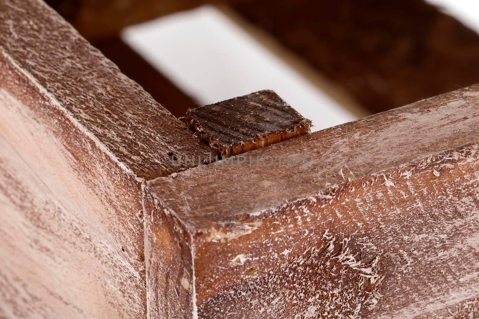 Fragment of a wooden box close-up on a white background