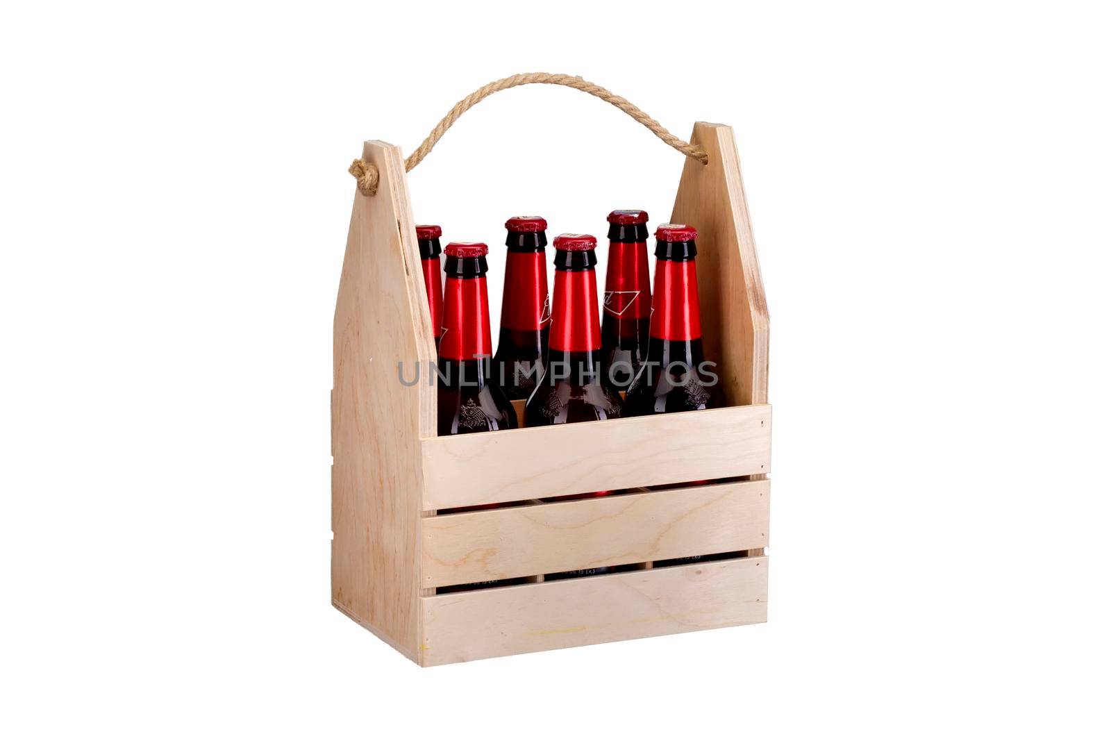 Wooden box with bottles on a white background