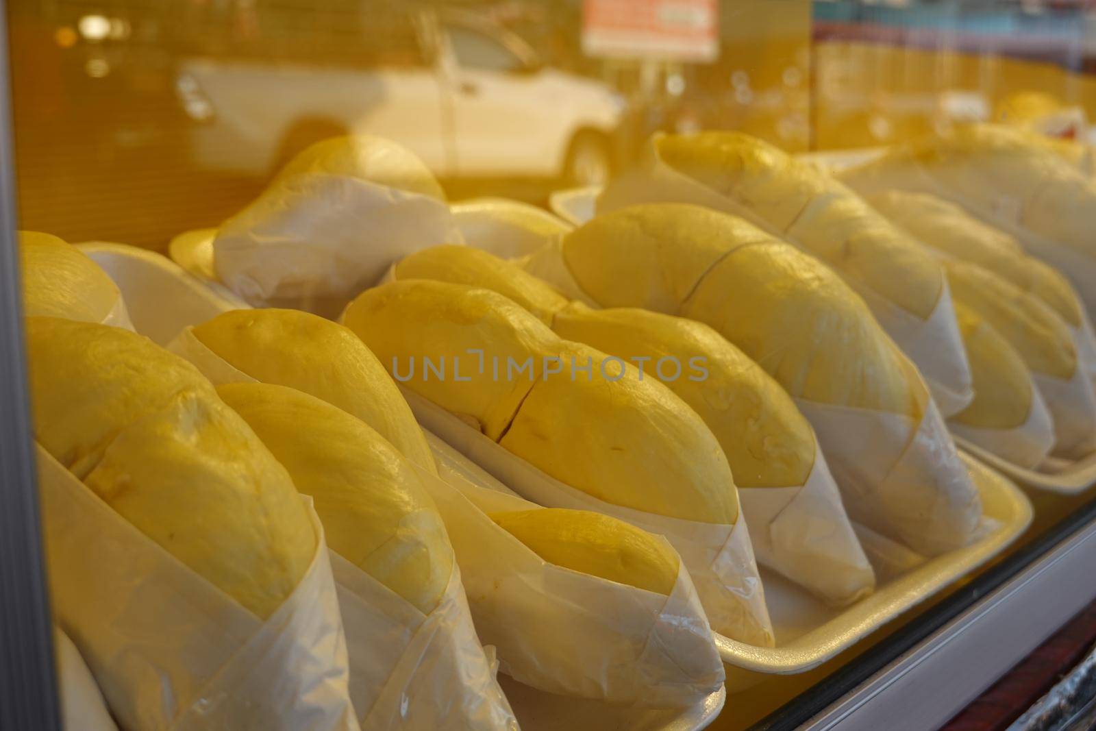 durian fruit in packages on sale in market, yellow durian in packaging as seasonal fruit of Thailand.  by chuanchai