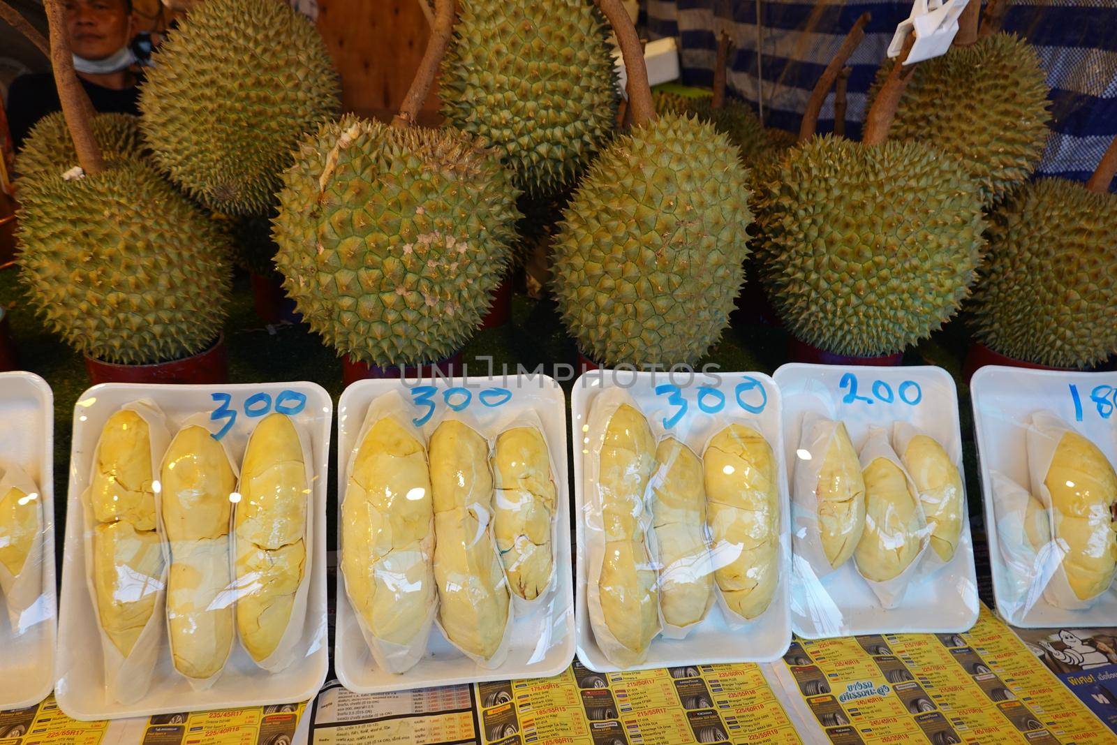 durian fruit in packages on sale in market, yellow durian in packaging as seasonal fruit of Thailand.  by chuanchai