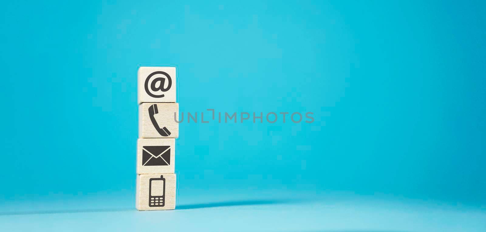 Contact Us Icons On Wooden Blocks by nirodesign