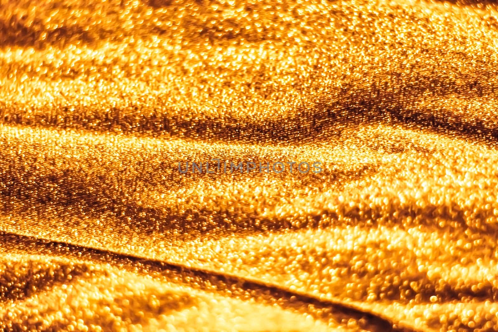 Luxe glowing texture, night club branding and New Years party concept - Golden holiday sparkling glitter abstract background, luxury shiny fabric material for glamour design and festive invitation