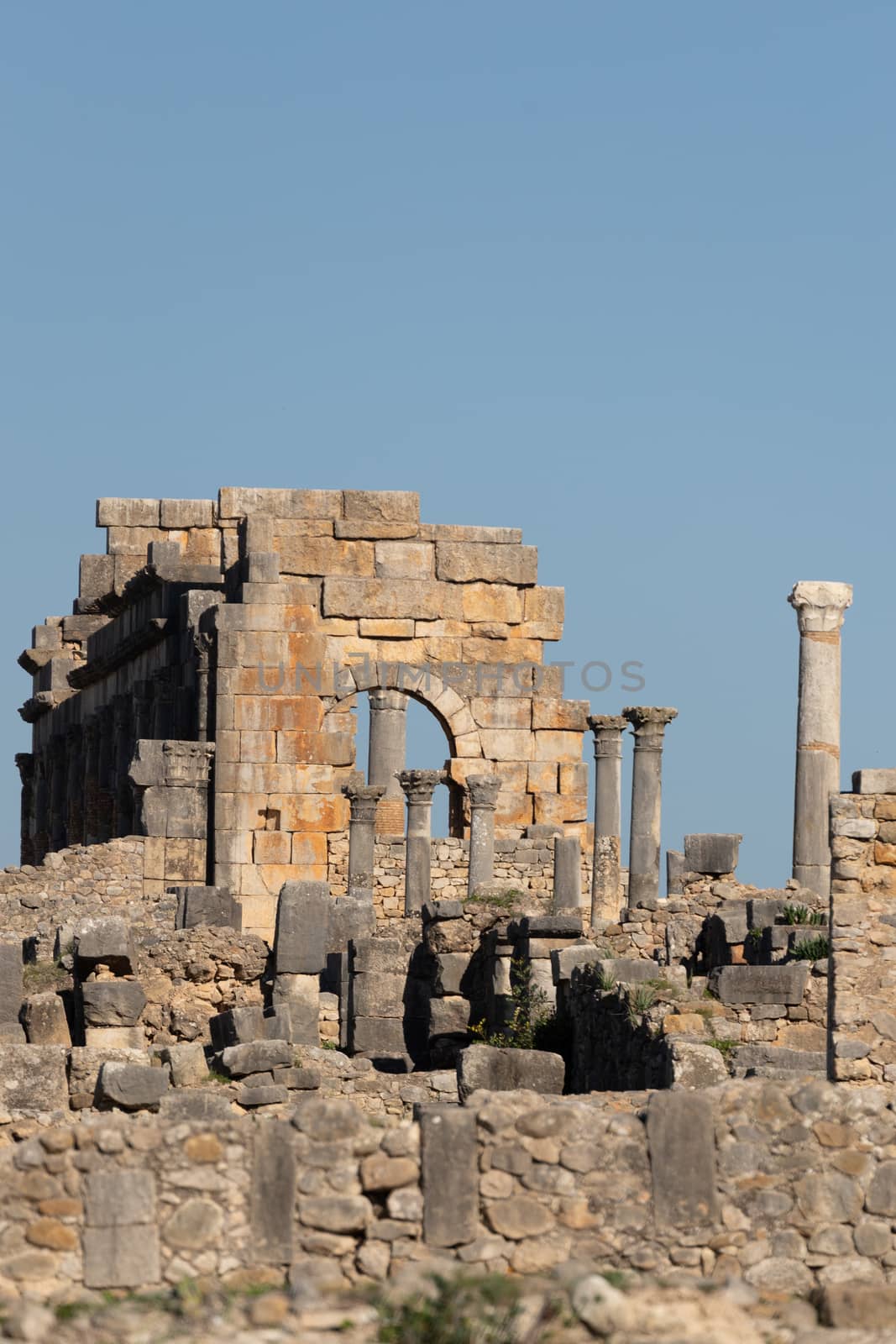 Volubilis is a site of Roman ruins and formerly a partly excavated Berber city in Morocco near the city of Meknes.The images show the ruined buildings and columns that are part of the large site High quality photo