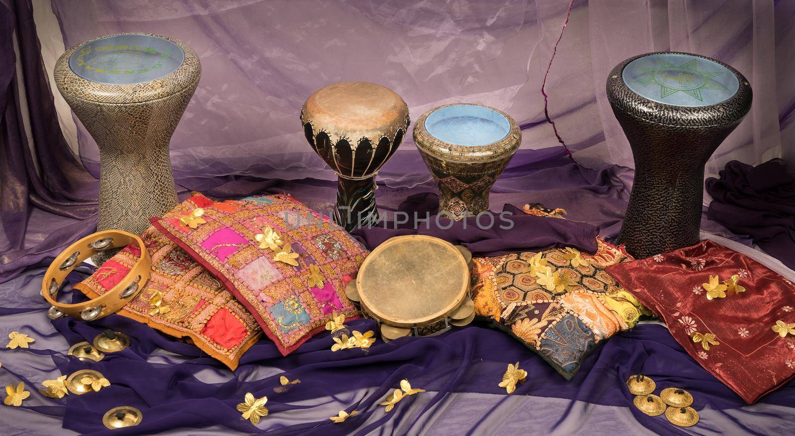 Musical instruments of a bellydance percussiongroup with darbuka's, tambourines and zills by LeoniekvanderVliet