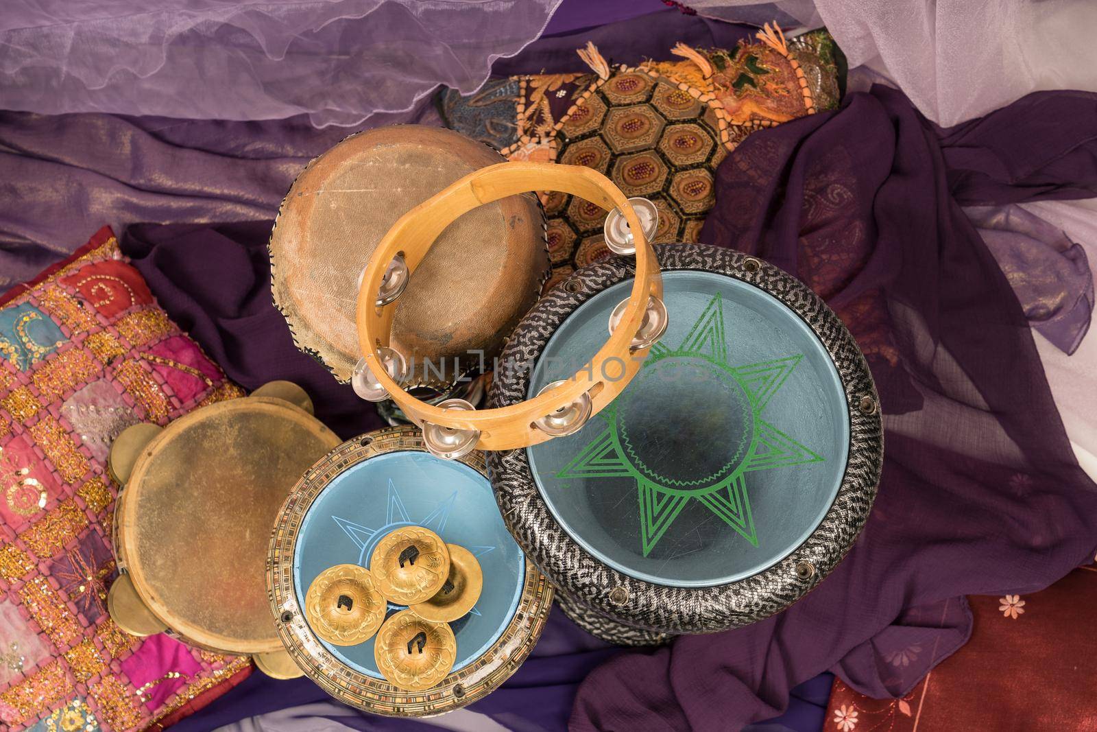 Top view of musical instruments of a bellydance percussiongroup with darbuka's, tambourines and zills